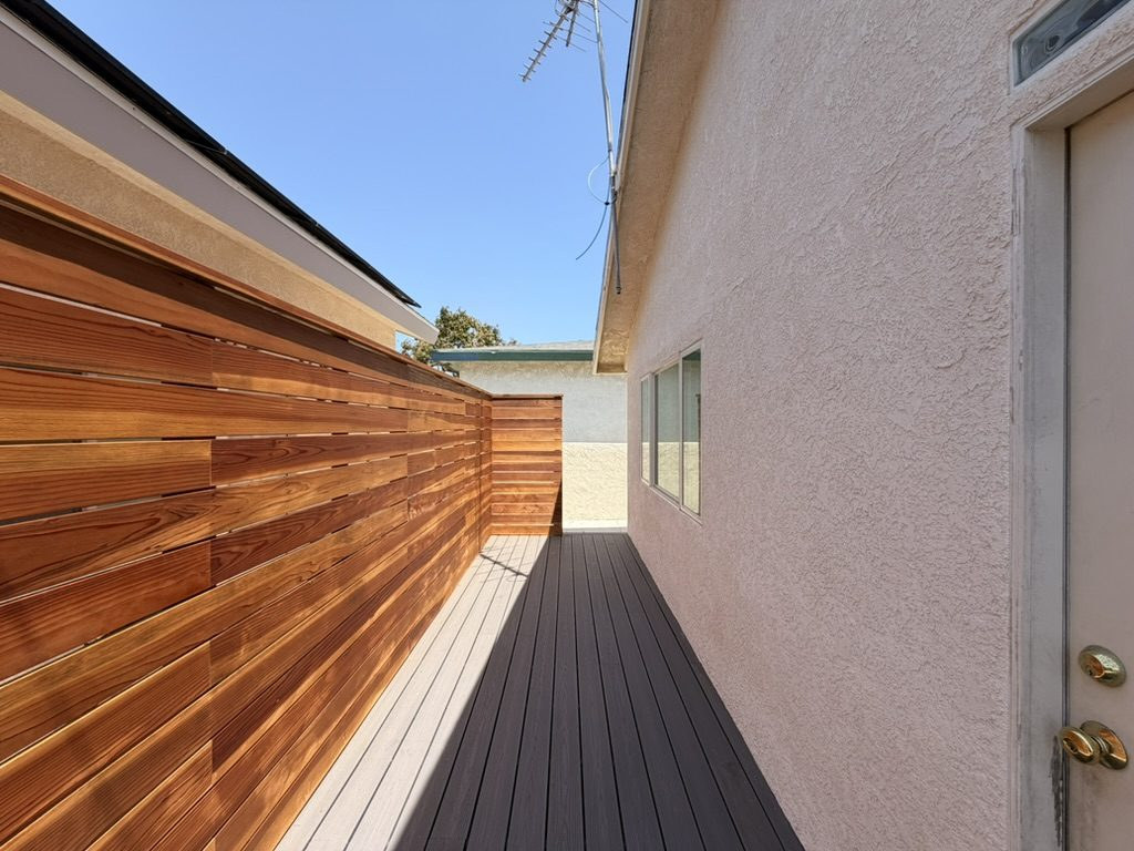 Redwood screen along the composite deck, built