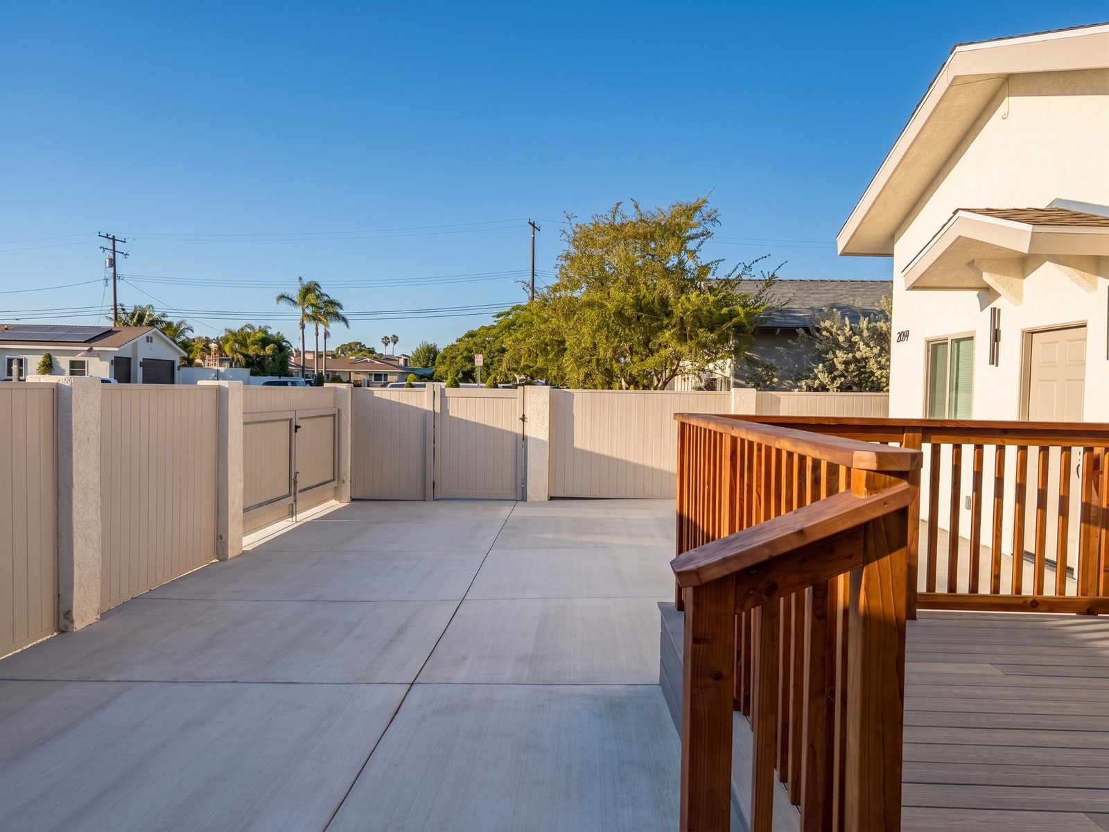 Composite deck and redwood rail from the driveway