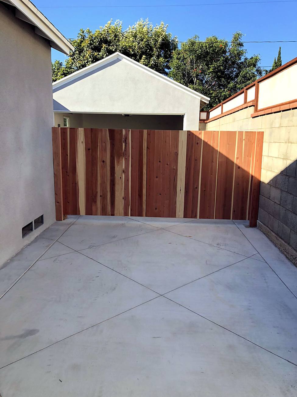 Fresh concrete and cedar fence, Walnut Residence
