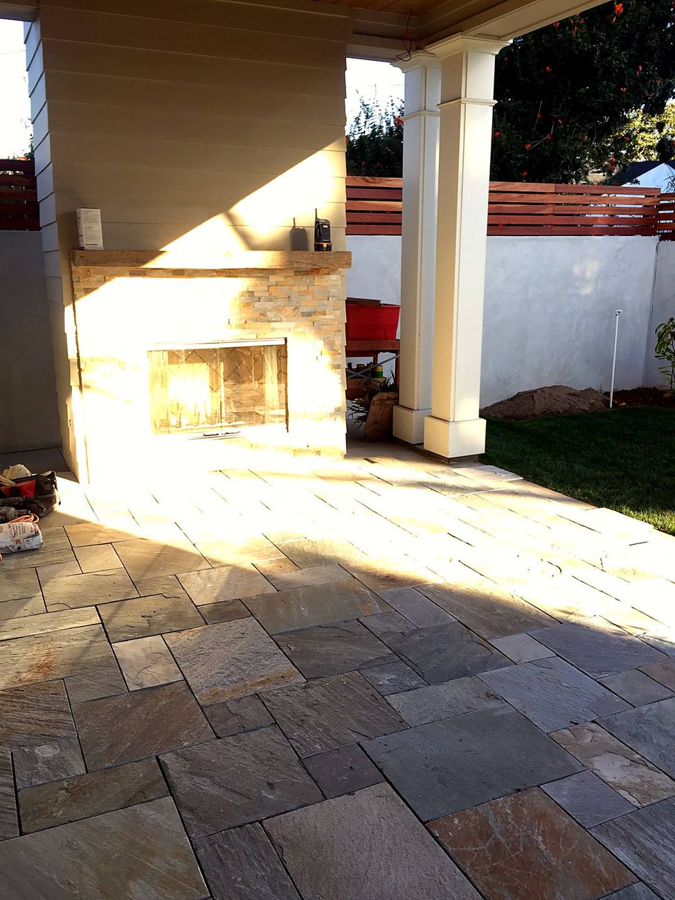 Stone patio with outdoor fireplace, Ynes Residence